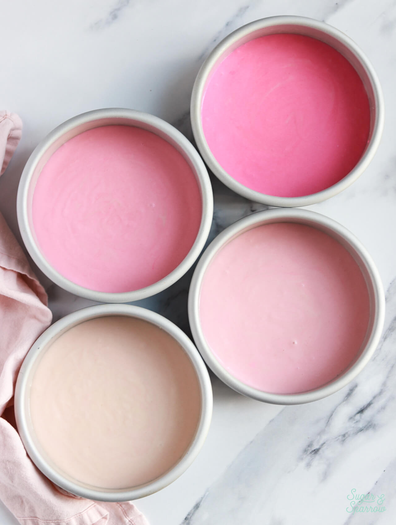 ombre pink cake batter in pans
