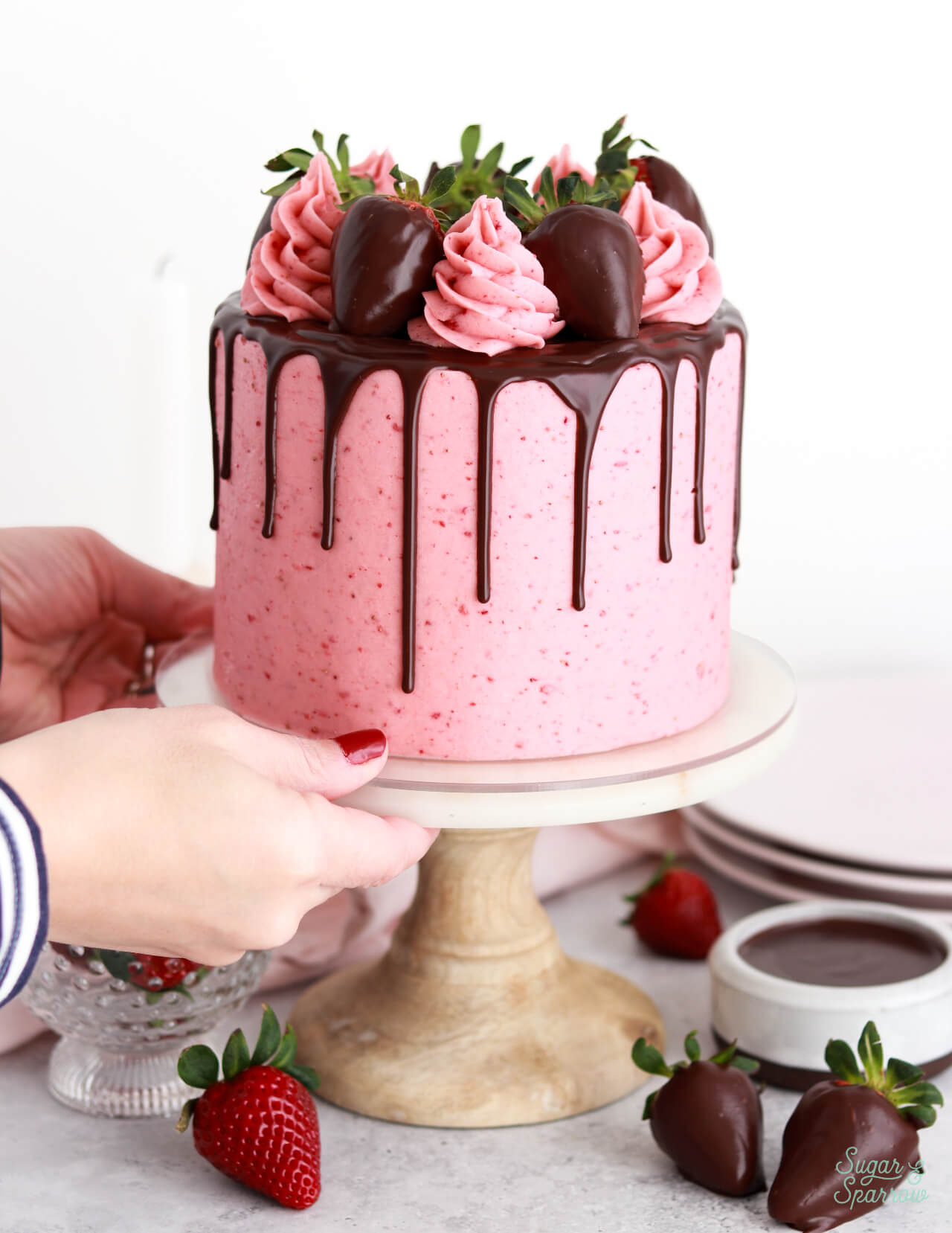 strawberry frosting on chocolate layer cake 