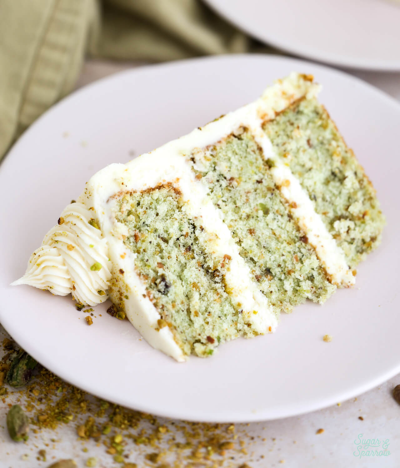 slice of pistachio cake on a plate