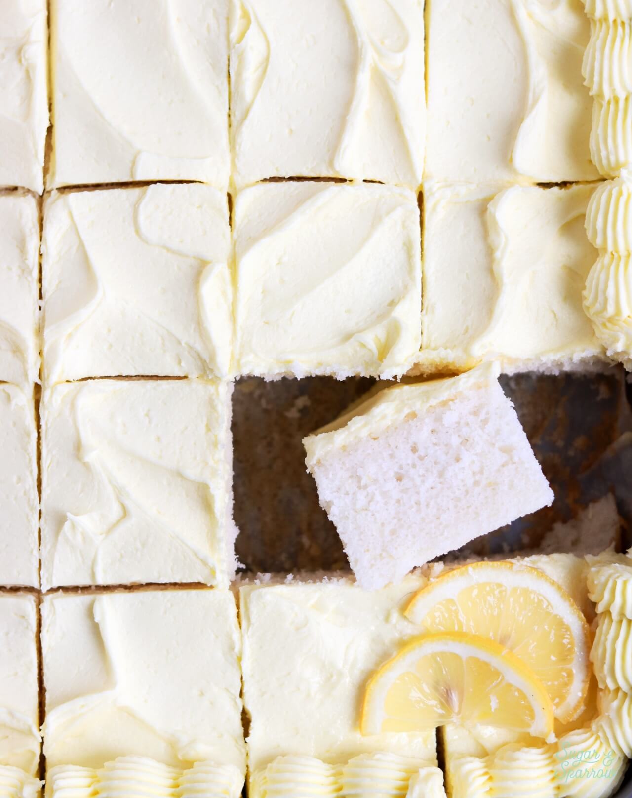 lemon sheet cake in 9x13 pan sliced into squares
