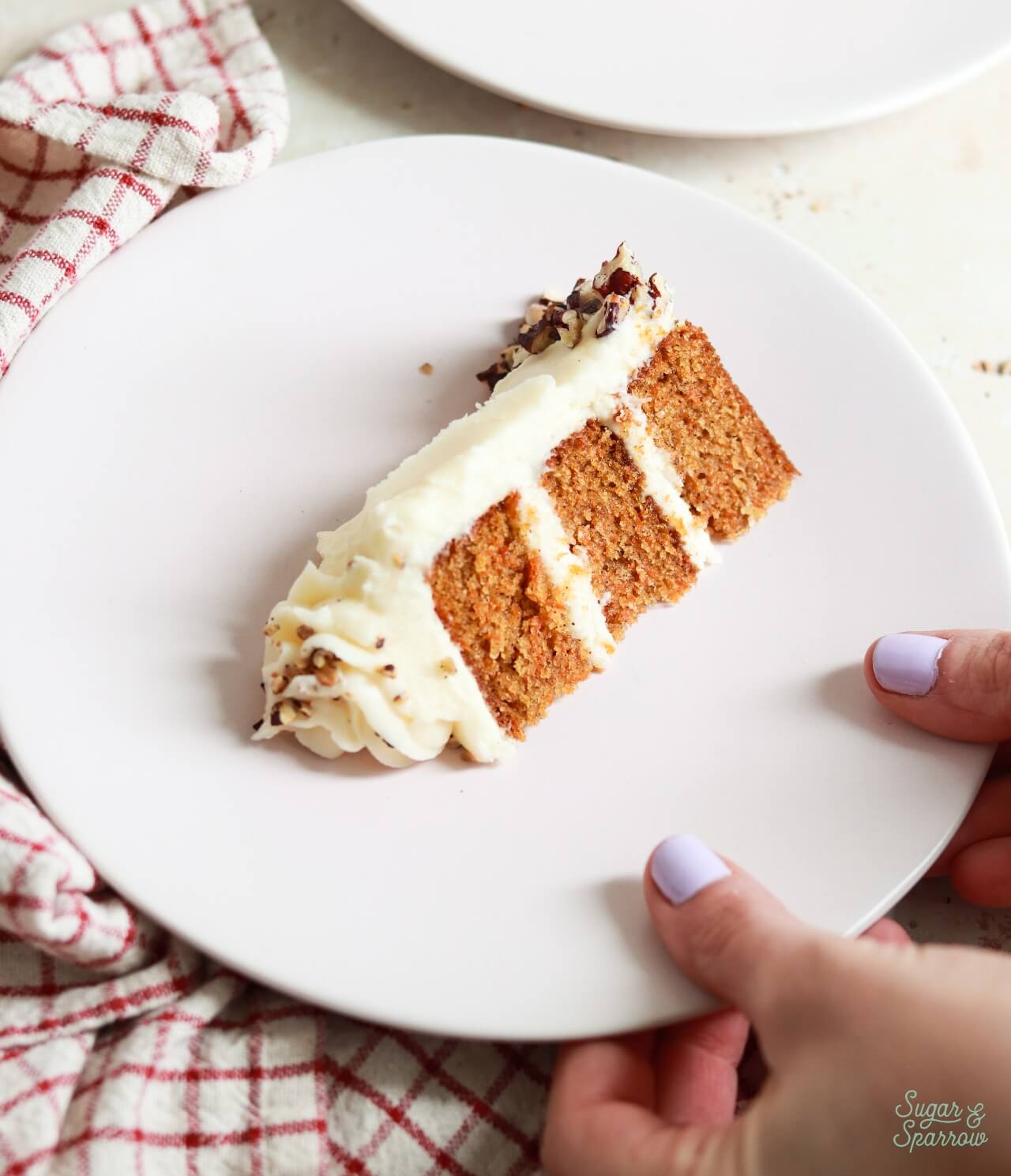 small batch carrot cake with cream cheese frosting slice on a plate