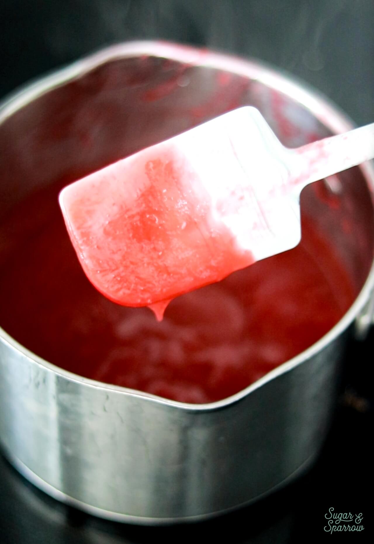 raspberry filling coating the spatula