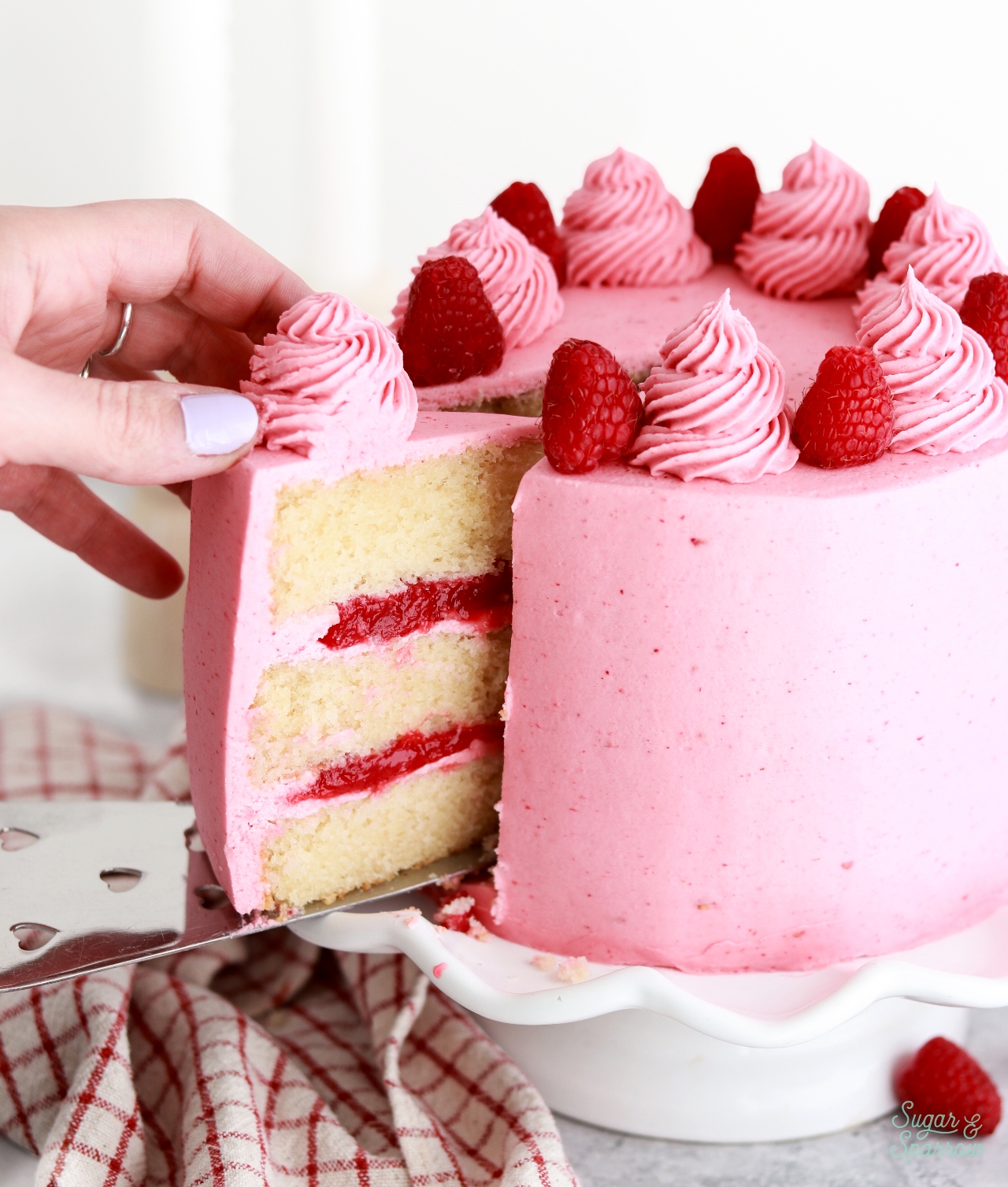 vanilla cake with raspberry filling and raspberry frosting