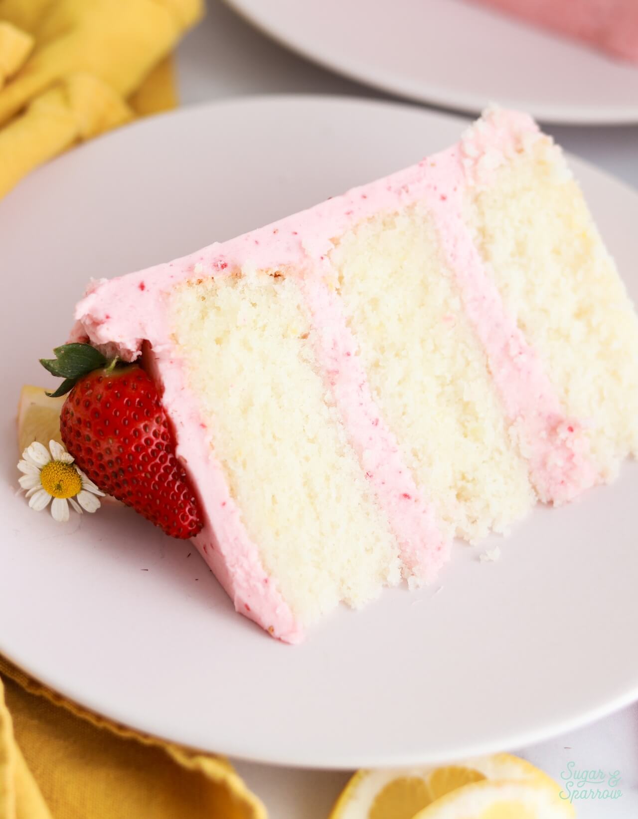 strawberry lemon cake slice on a plate