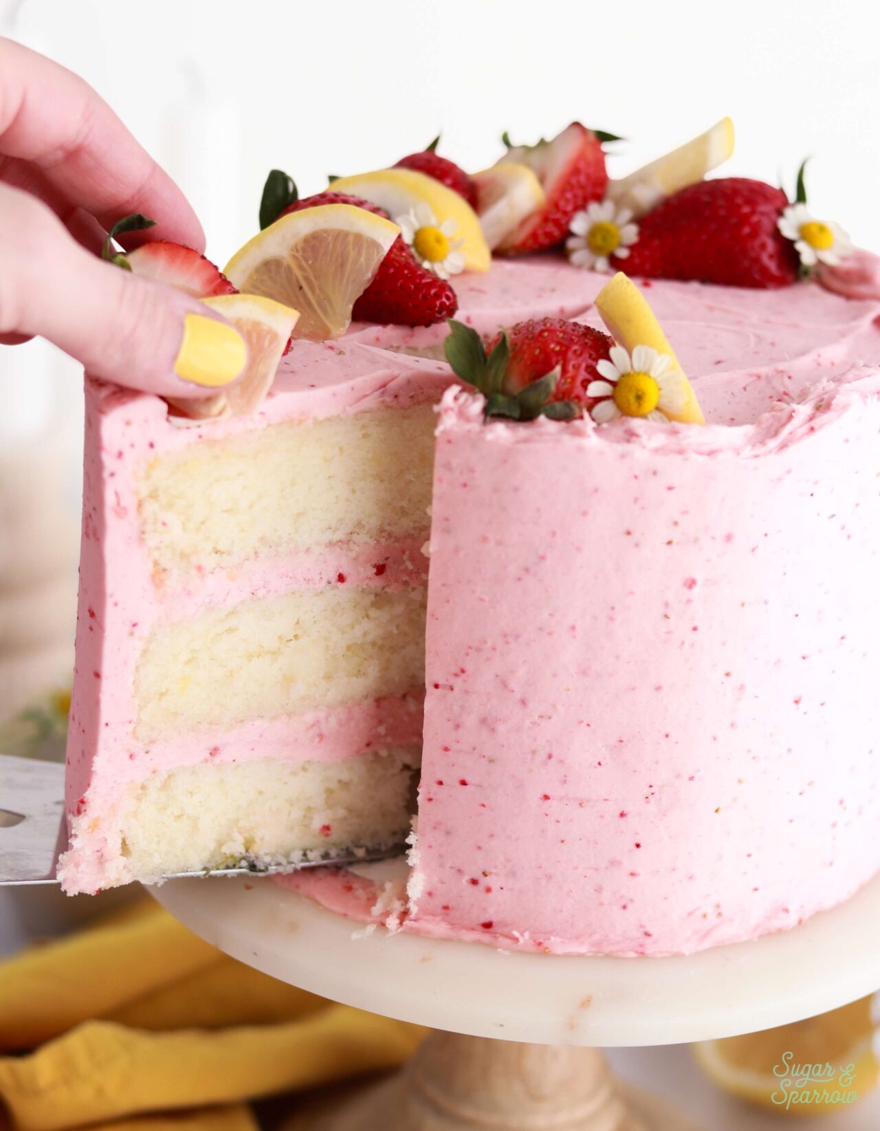 lemon cake with strawberry buttercream recipe by sugar and sparrow