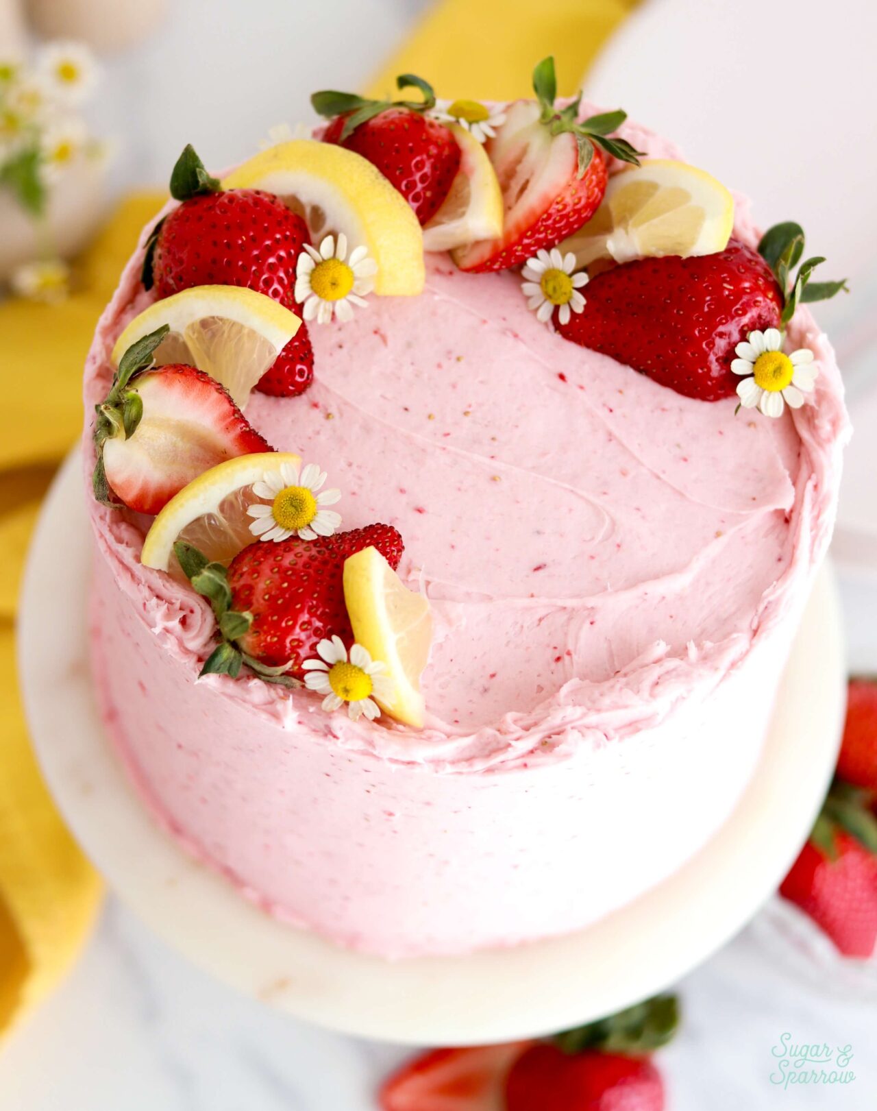 freeze dried strawberry buttercream on lemon layer cake