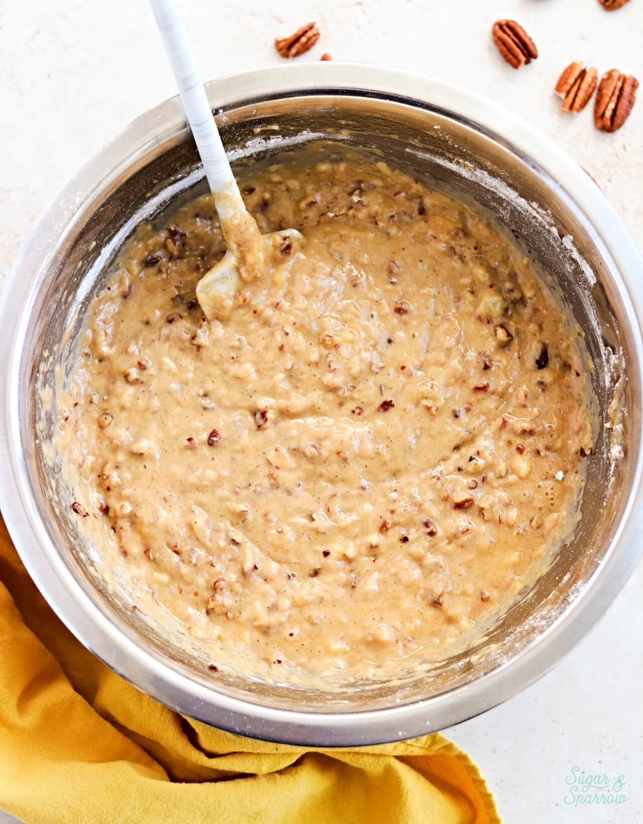 hummingbird cake batter with toasted pecans