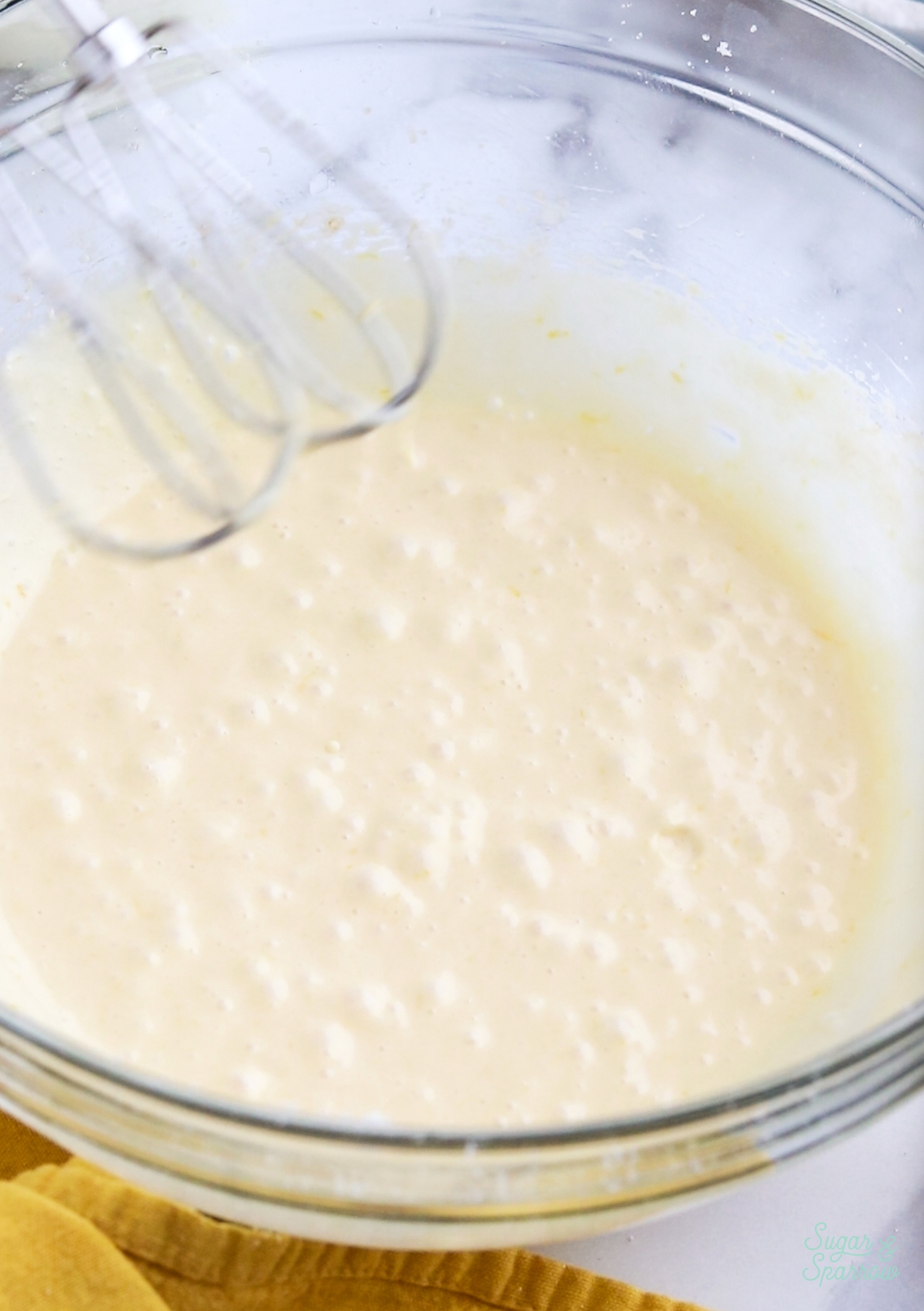 mixing up lemon cupcake batter