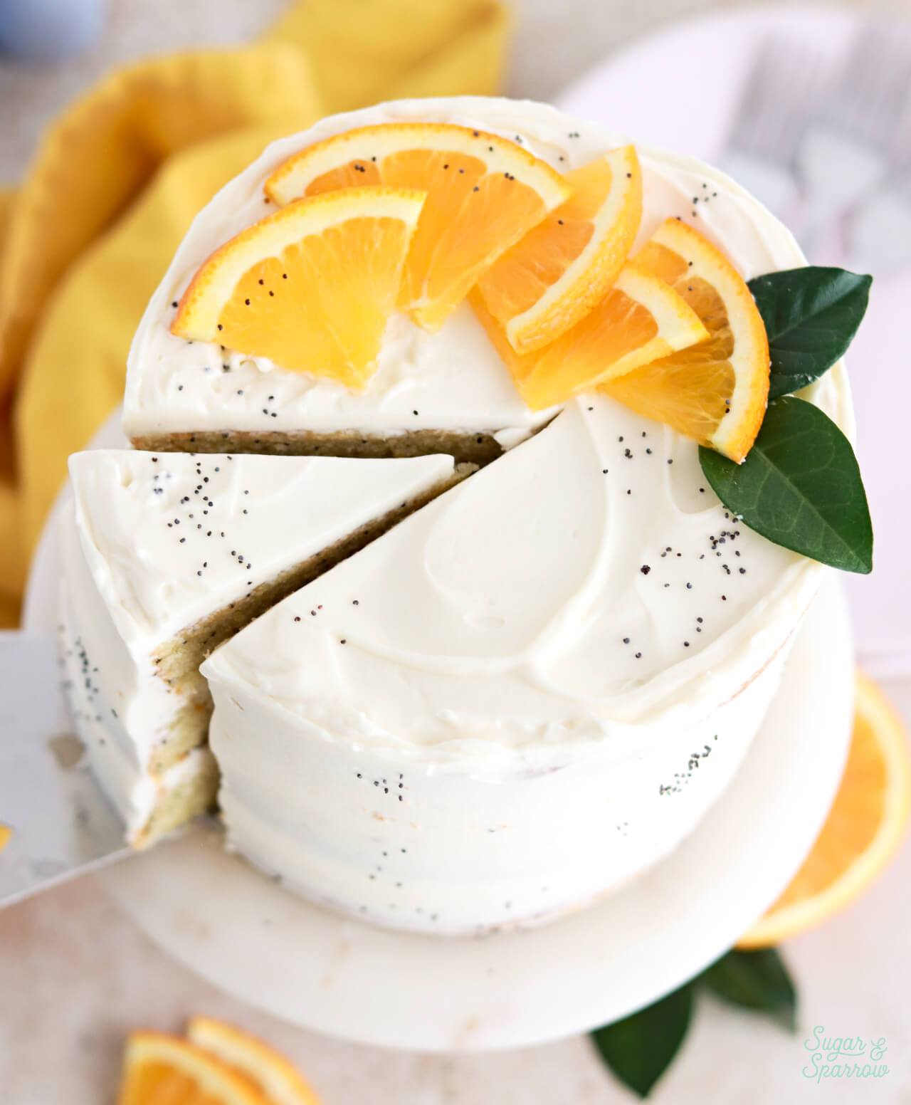 orange poppyseed cake with mascarpone whipped cream frosting