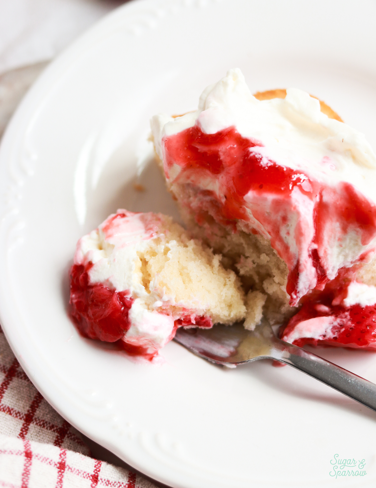 slice of strawberry shortcake sheet cake on a plate