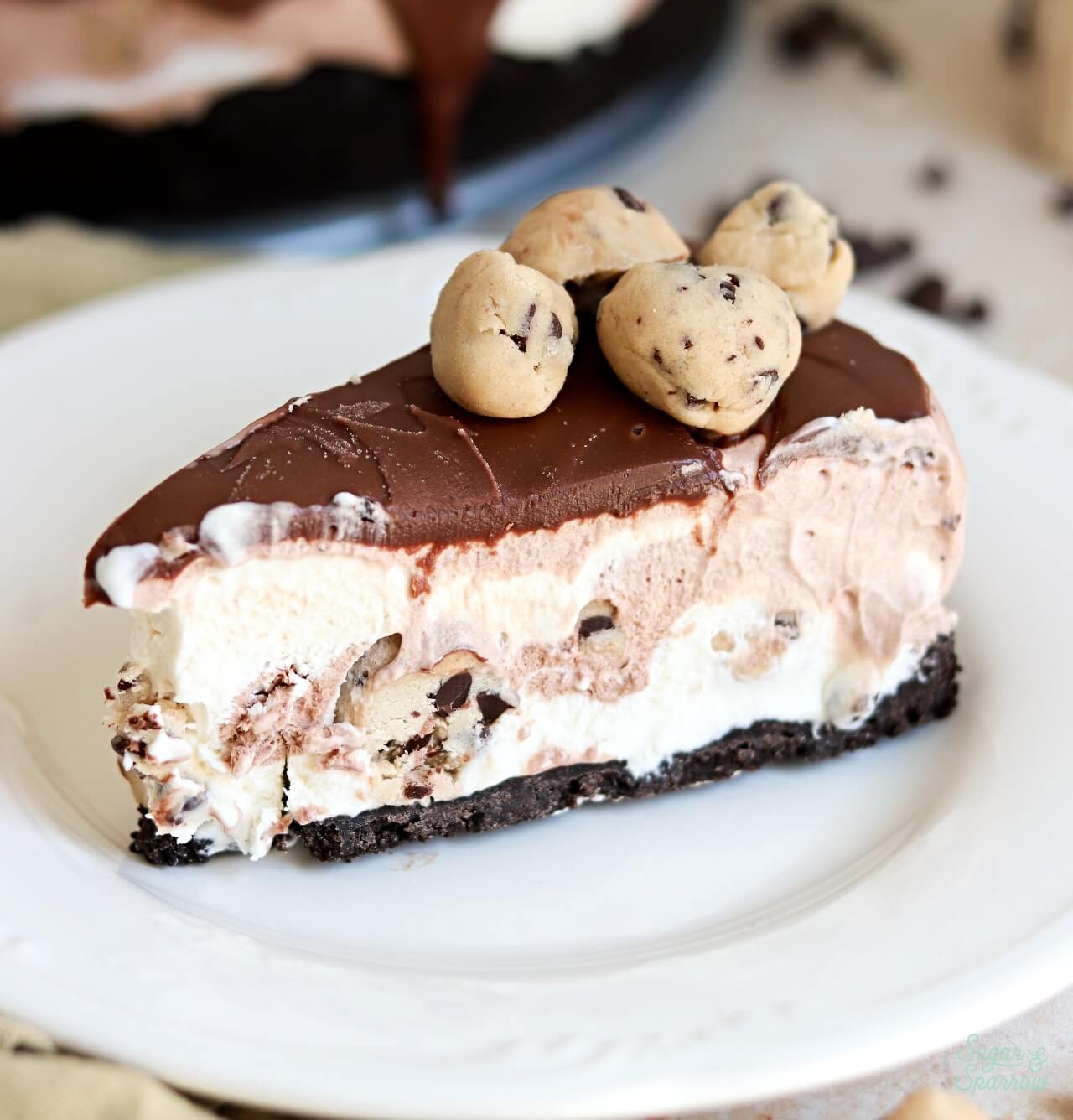 no-churn chocolate ice cream cake with cookie dough chunks and oreo crust