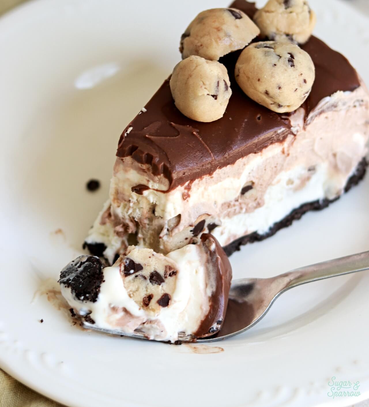 homemade ice cream cake with cookie dough chunks and oreo cookie crust