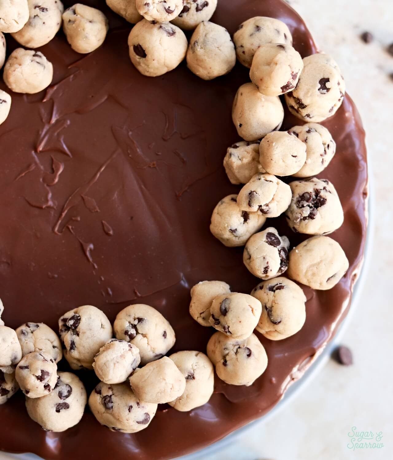 cookie dough balls on top of ice cream cake
