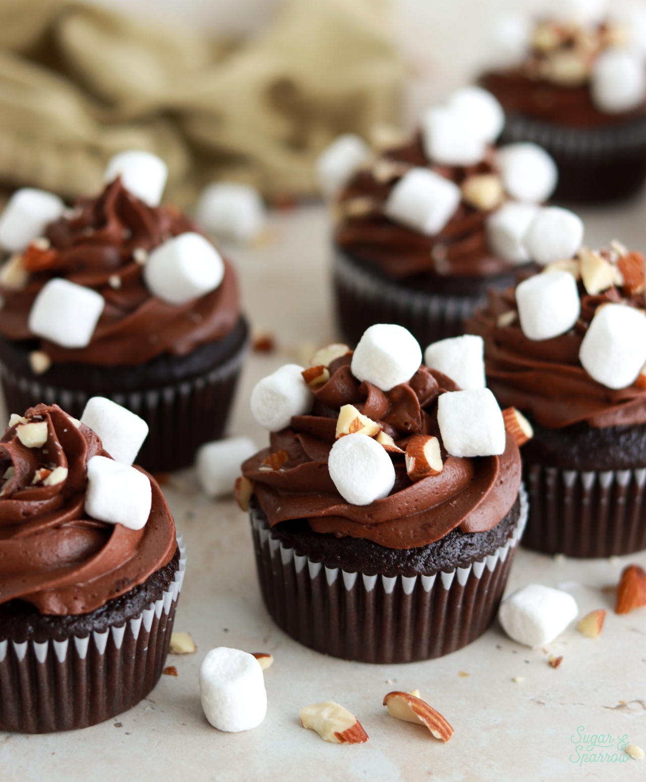 chocolate cupcakes with marshmallow creme filling and rocky road toppings