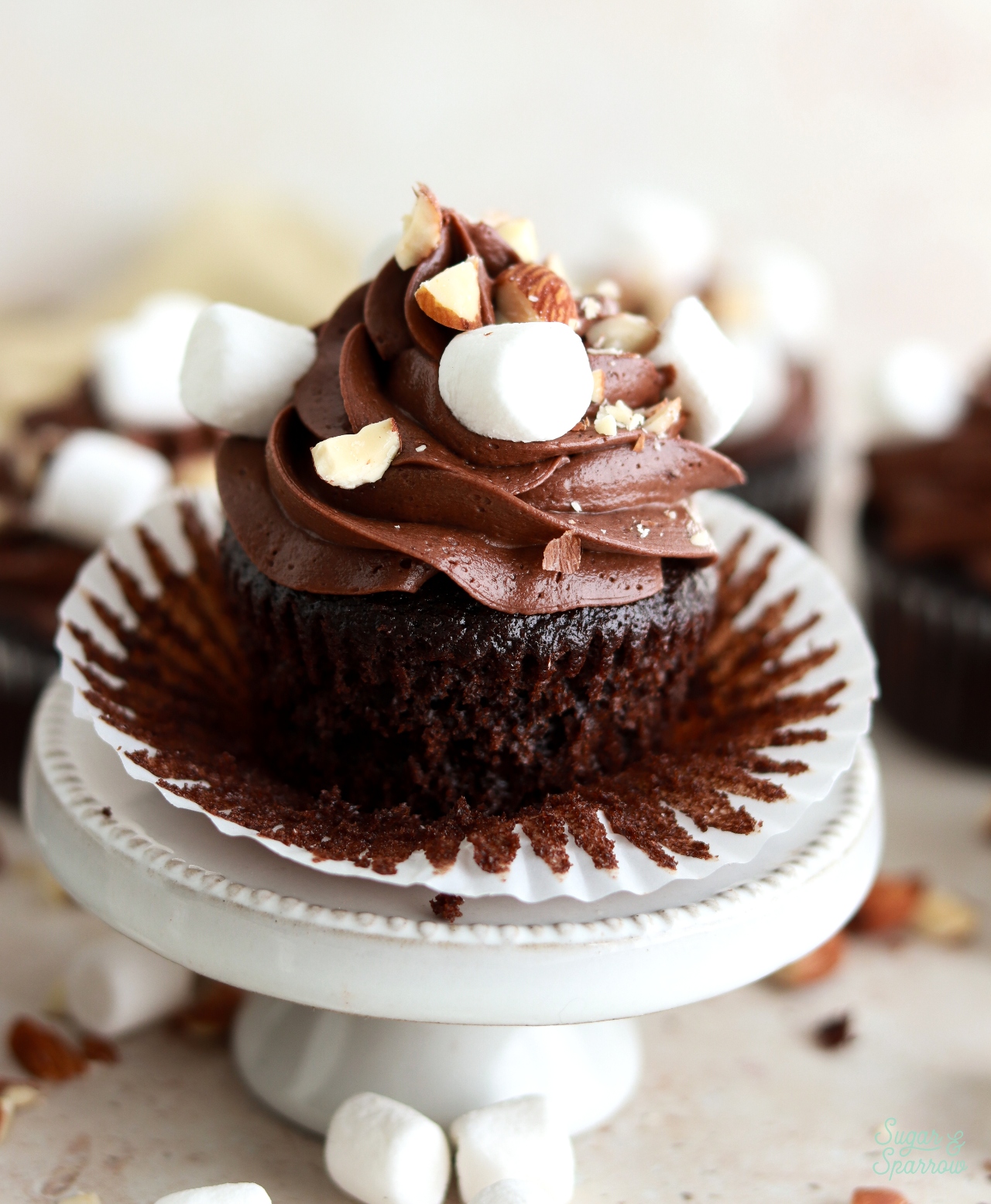 rocky road cupcake recipe with chopped almonds and mini marshmallows