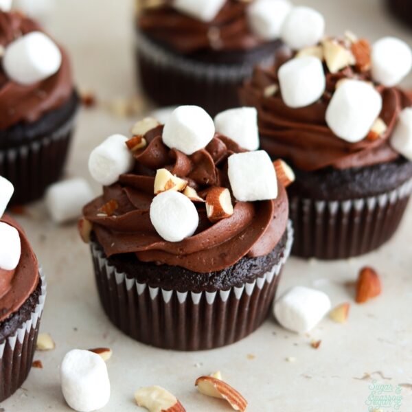 chocolate cupcakes with chocolate buttercream, marshmallow filling, mini marshmallows, and chopped almonds