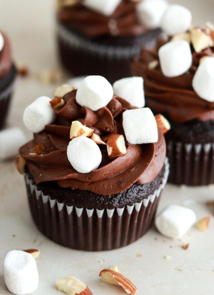 chocolate cupcakes with chocolate buttercream, marshmallow filling, mini marshmallows, and chopped almonds