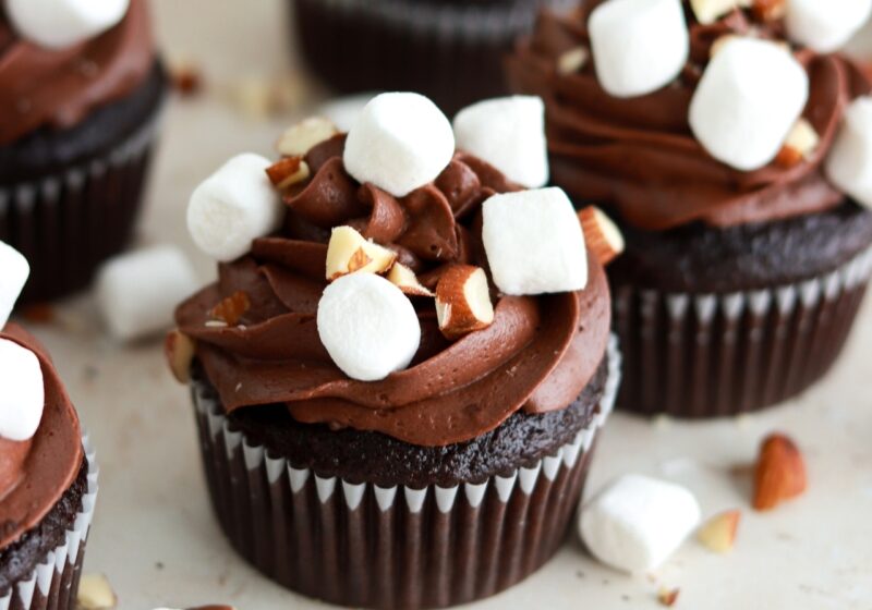 chocolate cupcakes with chocolate buttercream, marshmallow filling, mini marshmallows, and chopped almonds