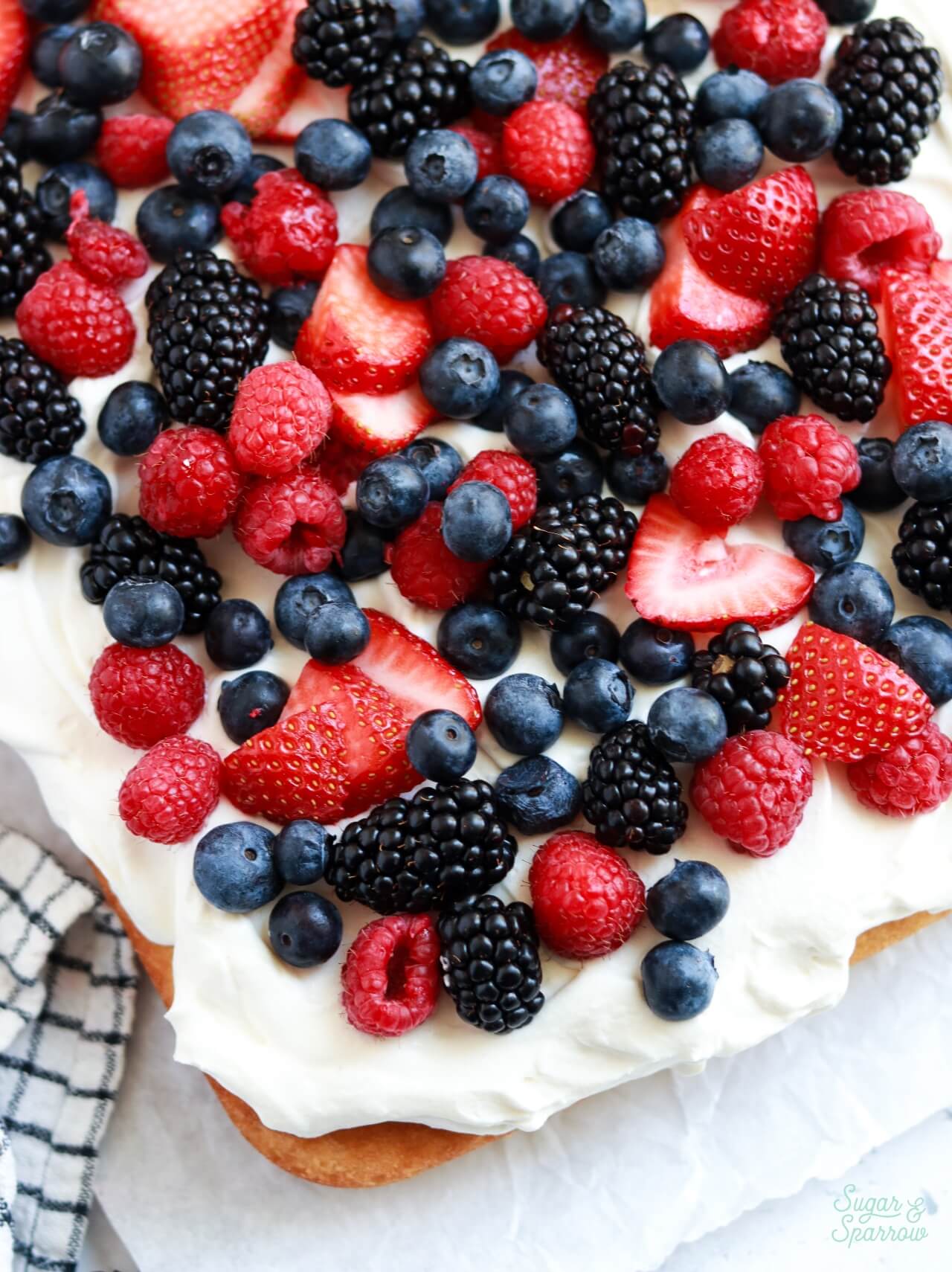 berries and cream cae with strawberries, blackberries, blueberries, and raspberries