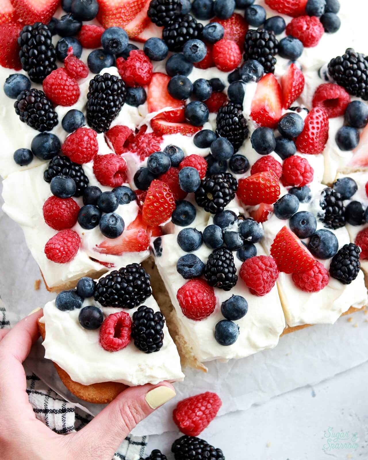 sliced berries and cream sheet cake