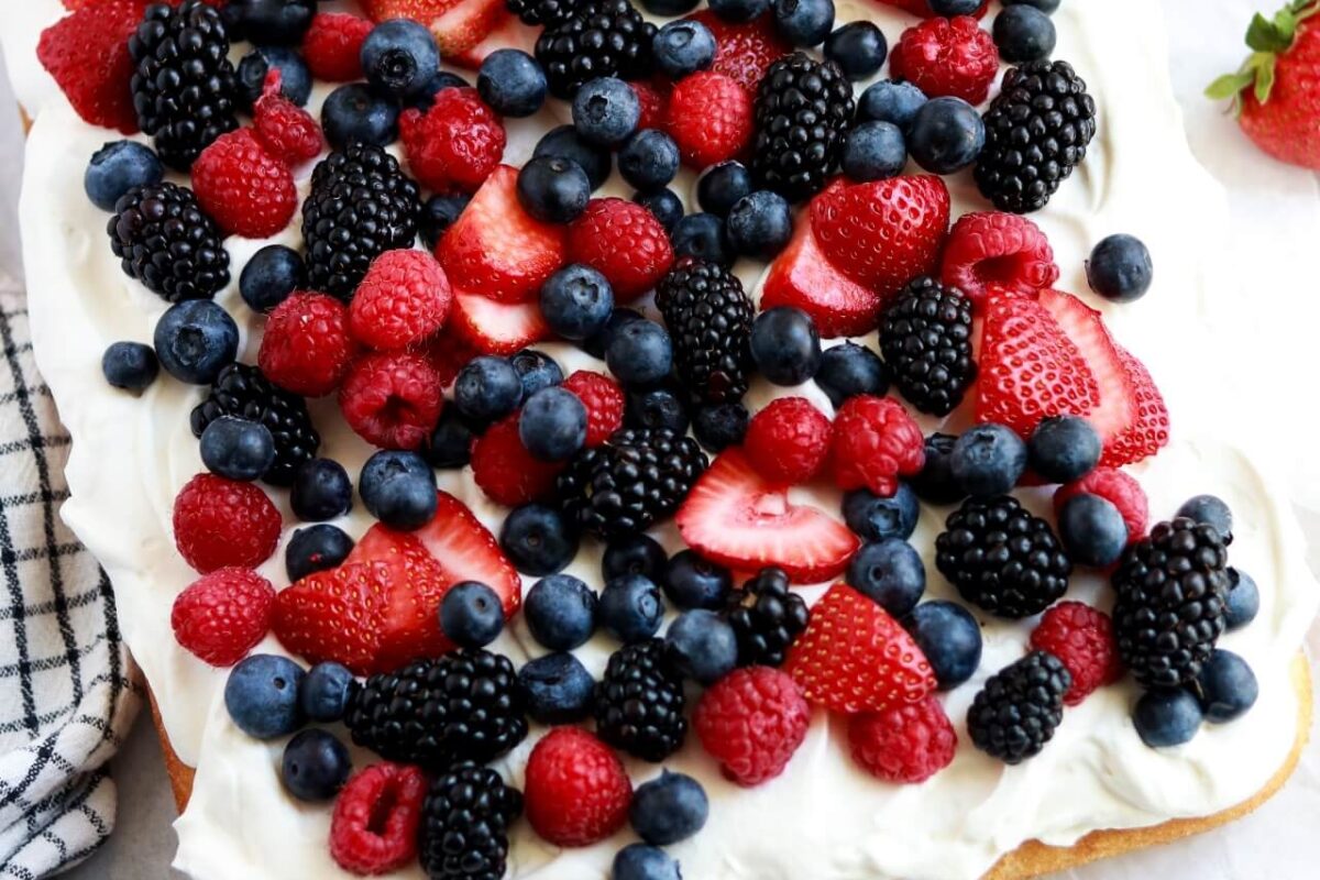 berries and cream sheet cake by sugar and sparrow
