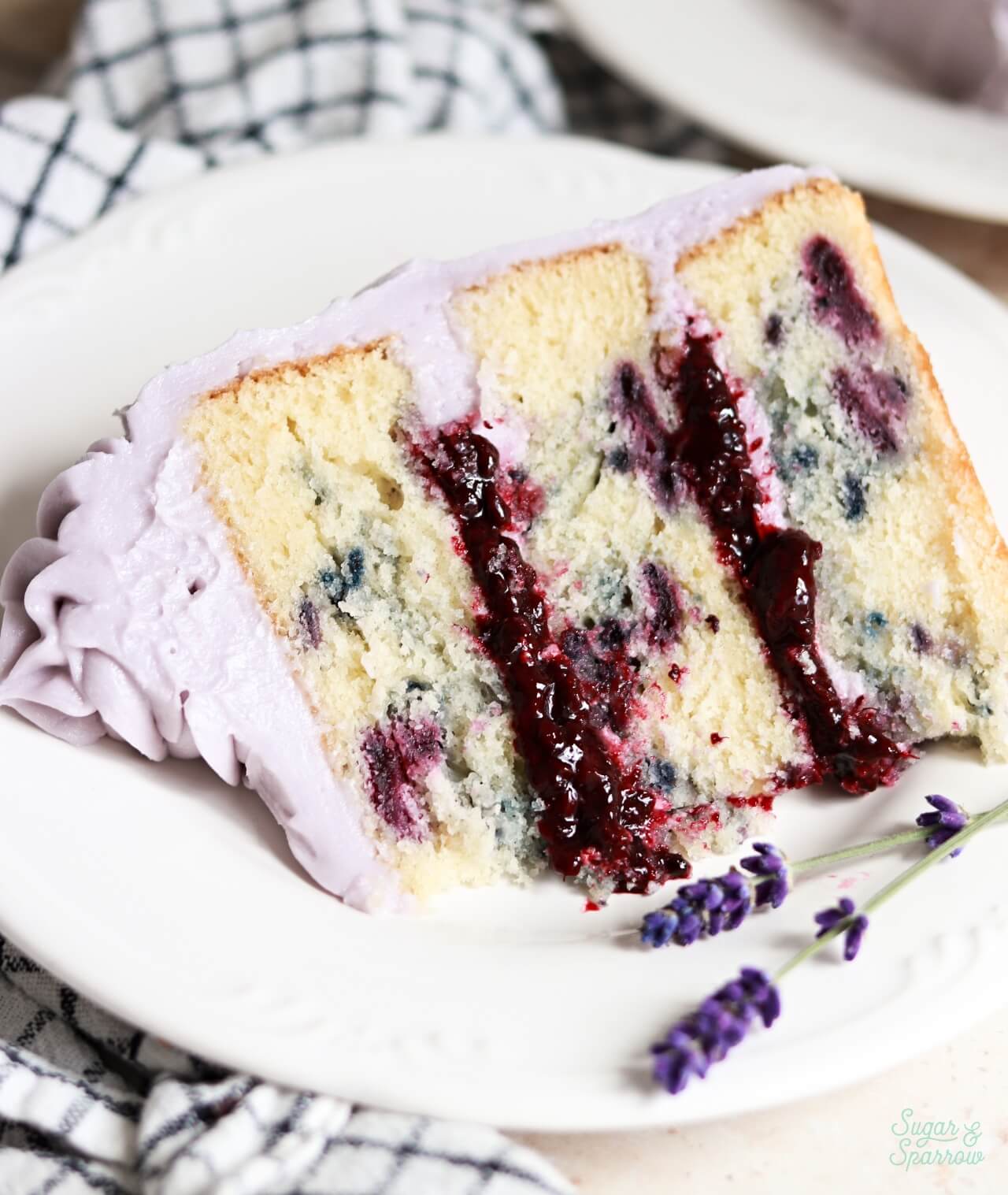 blackberry lavender cake slice on a plate