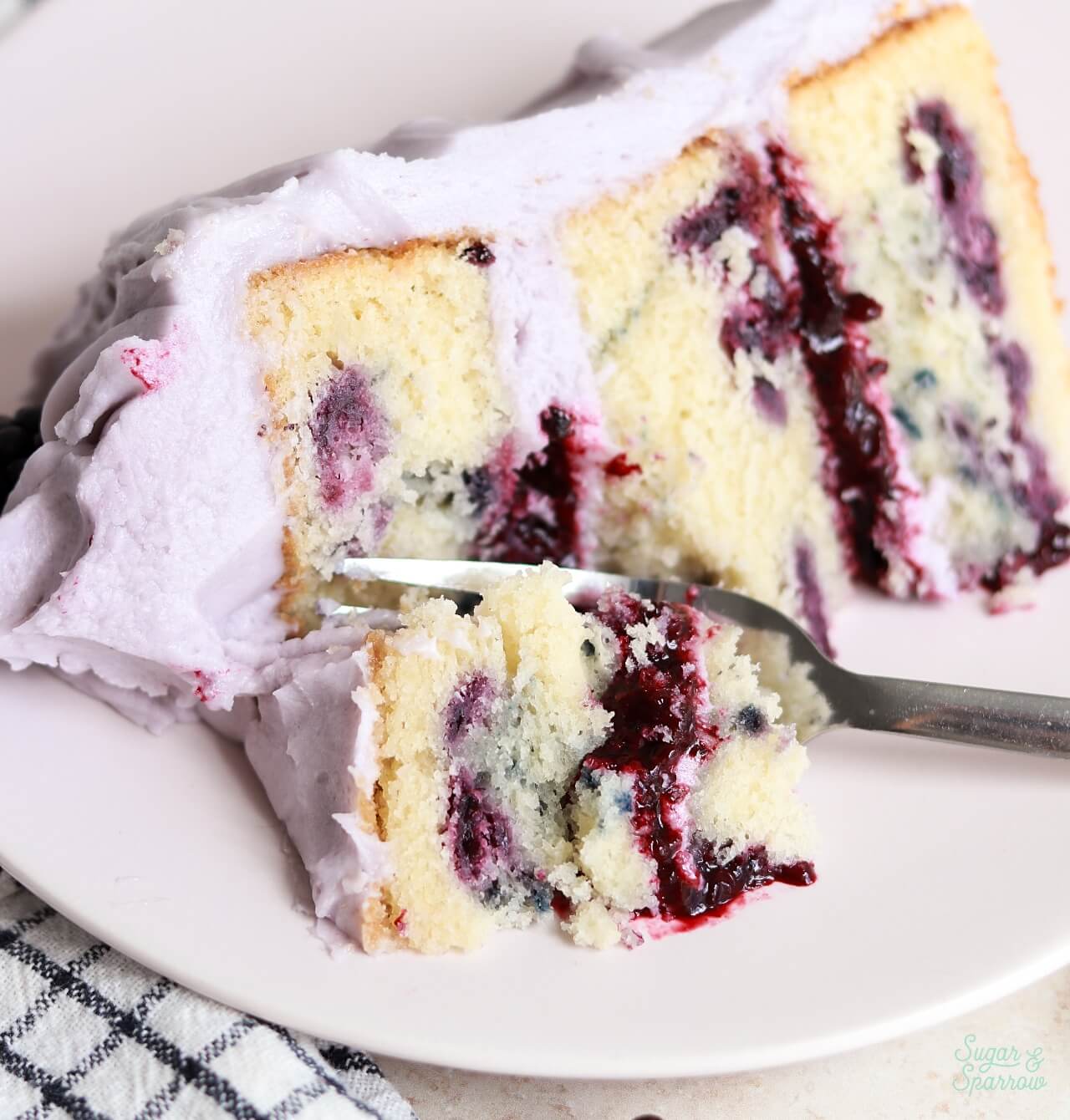 blackberry vanilla cake with blackberry filling and lavender frosting