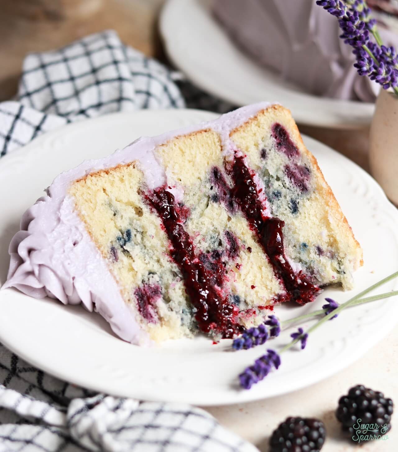 blackberry layer cake with blackberry cake filling and lavender buttercream