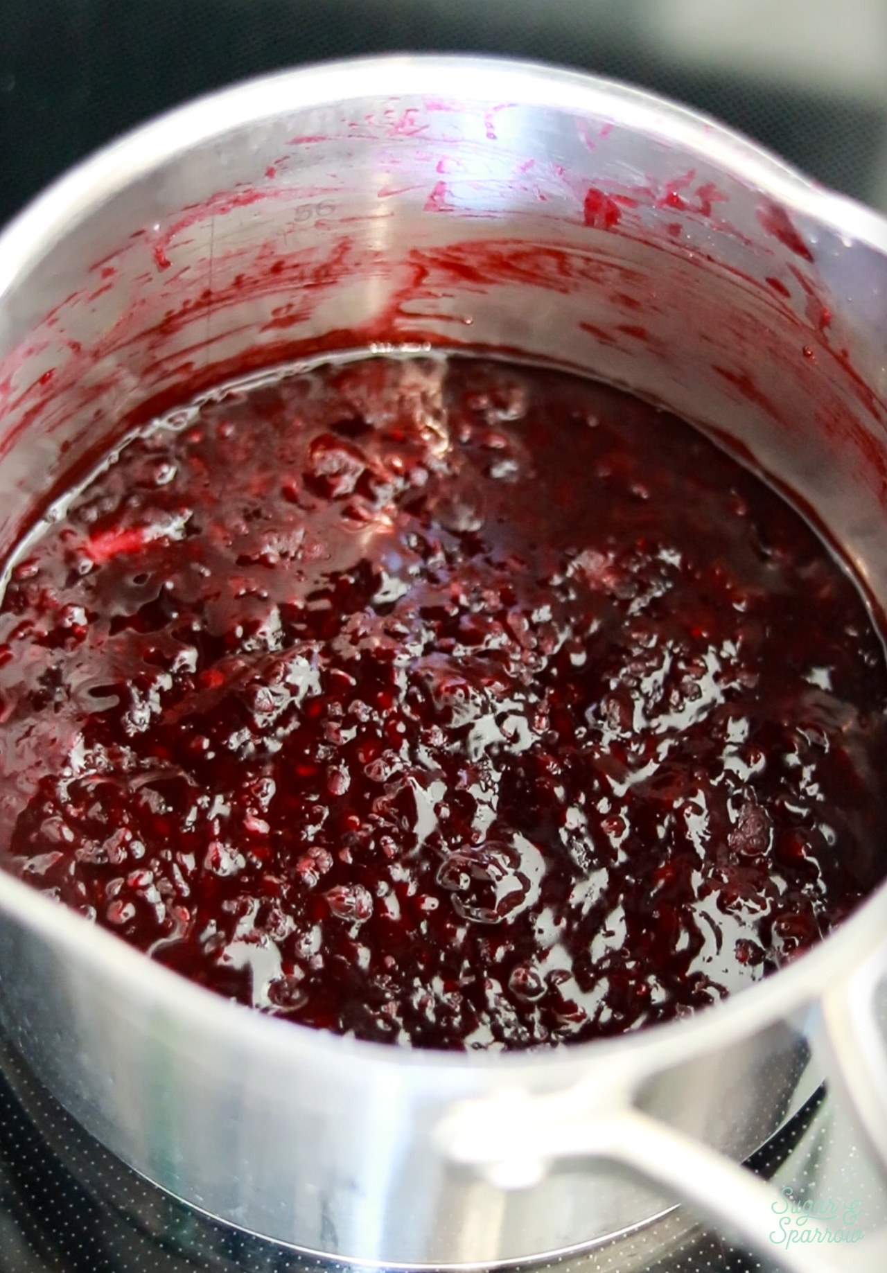 cooking blackberry puree in a saucepan