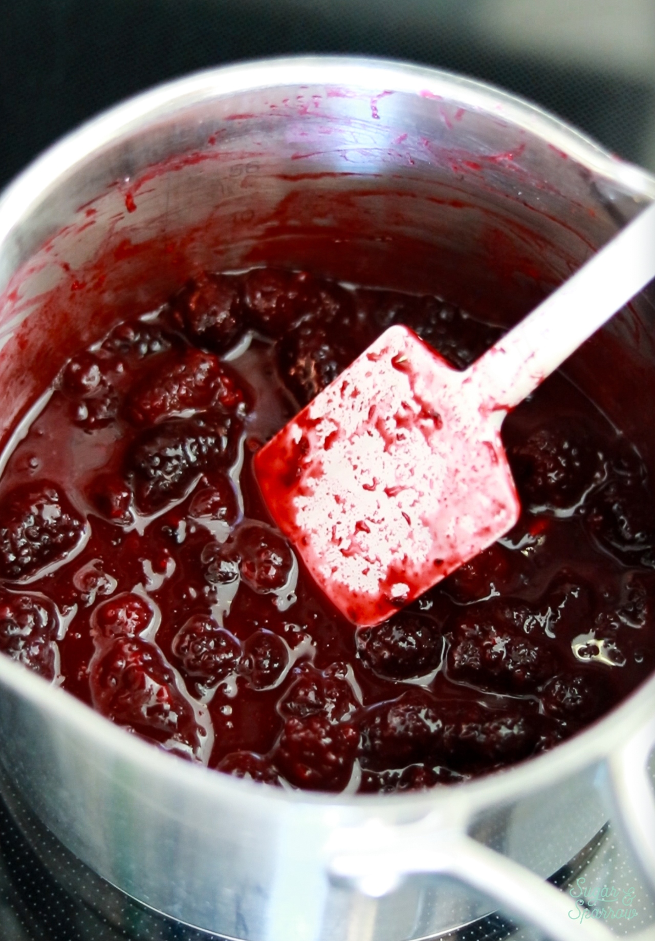 cooking blackberries in a saucepan