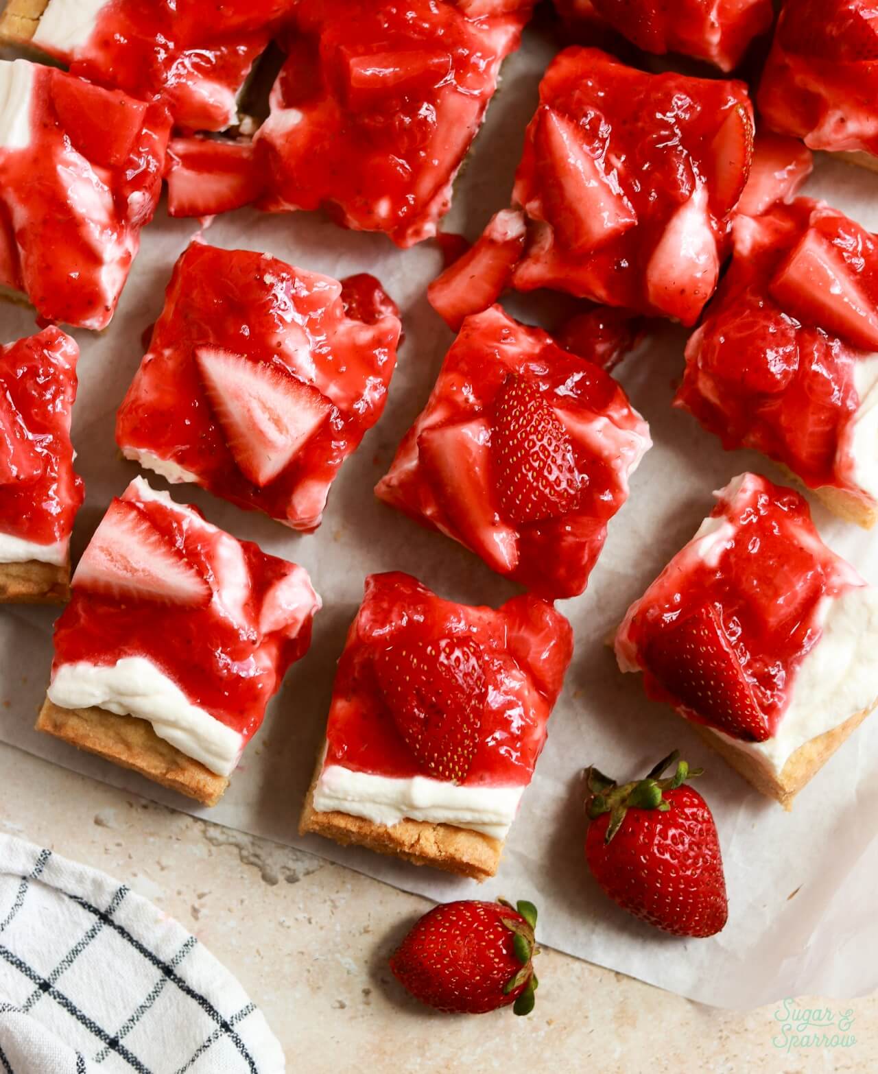 frosted sugar cookie bars sliced into squares