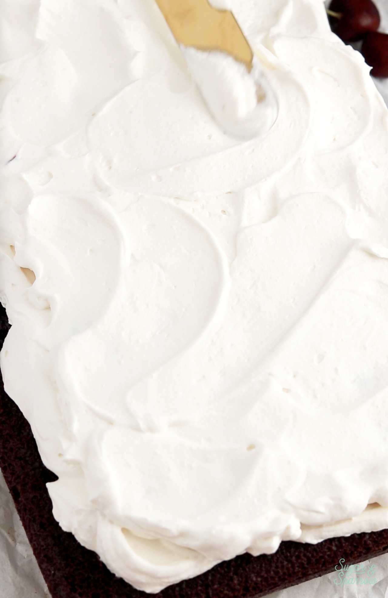 frosting black forest cake with whipped cream frosting