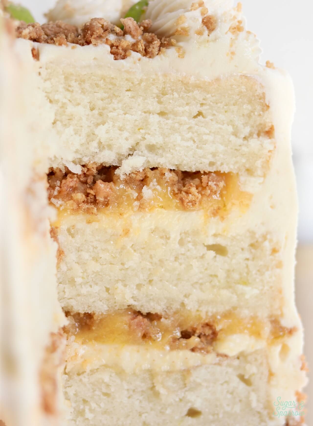 key lime cake layers with key lime curd, graham cracker crumble, and key lime buttercream