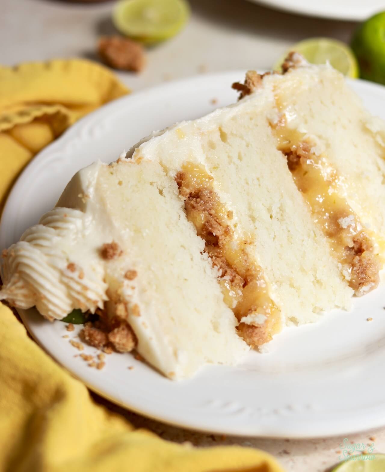 cake filled with key lime curd and graham cracker crumble