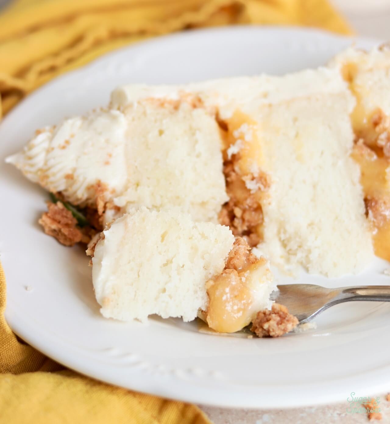key lime cake slice with lime curd and graham cracker clusters