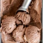 scoops of no churn chocolate ice cream in a loaf pan