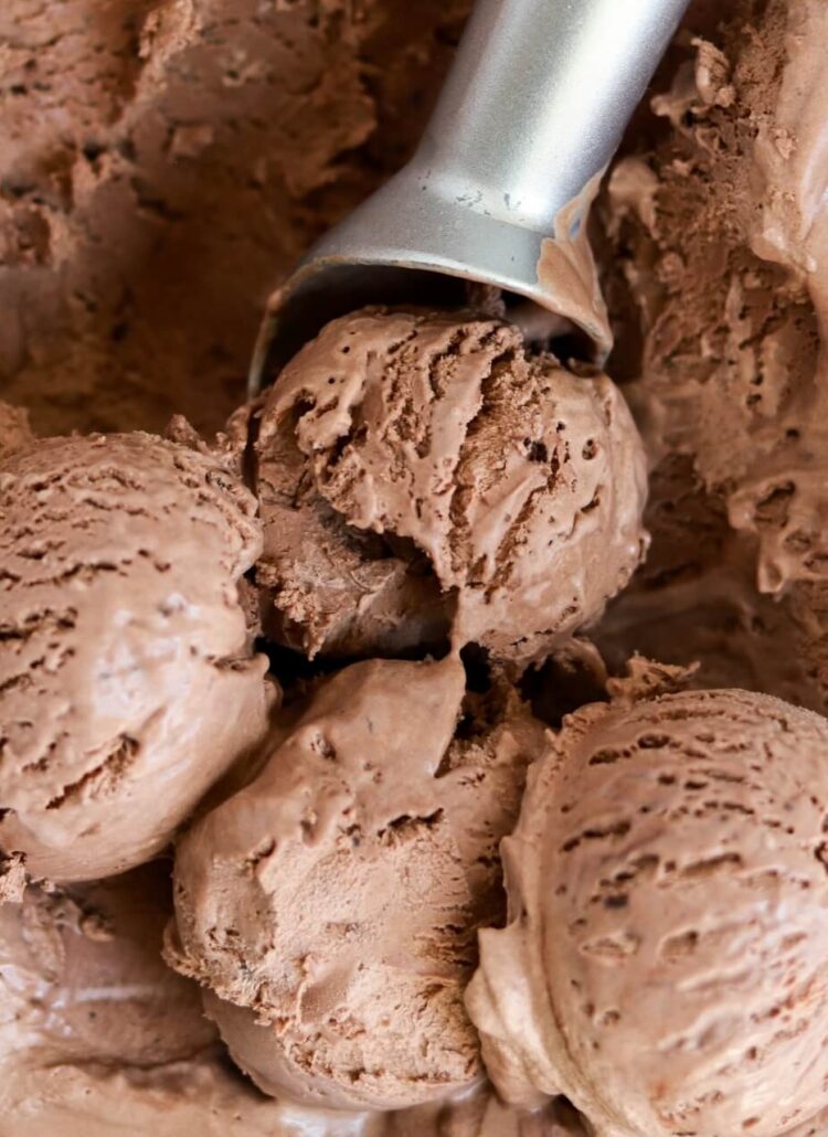 scoops of no churn chocolate ice cream in a loaf pan