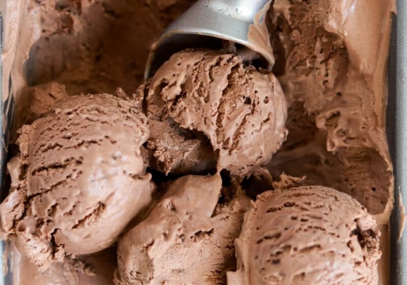 scoops of no churn chocolate ice cream in a loaf pan