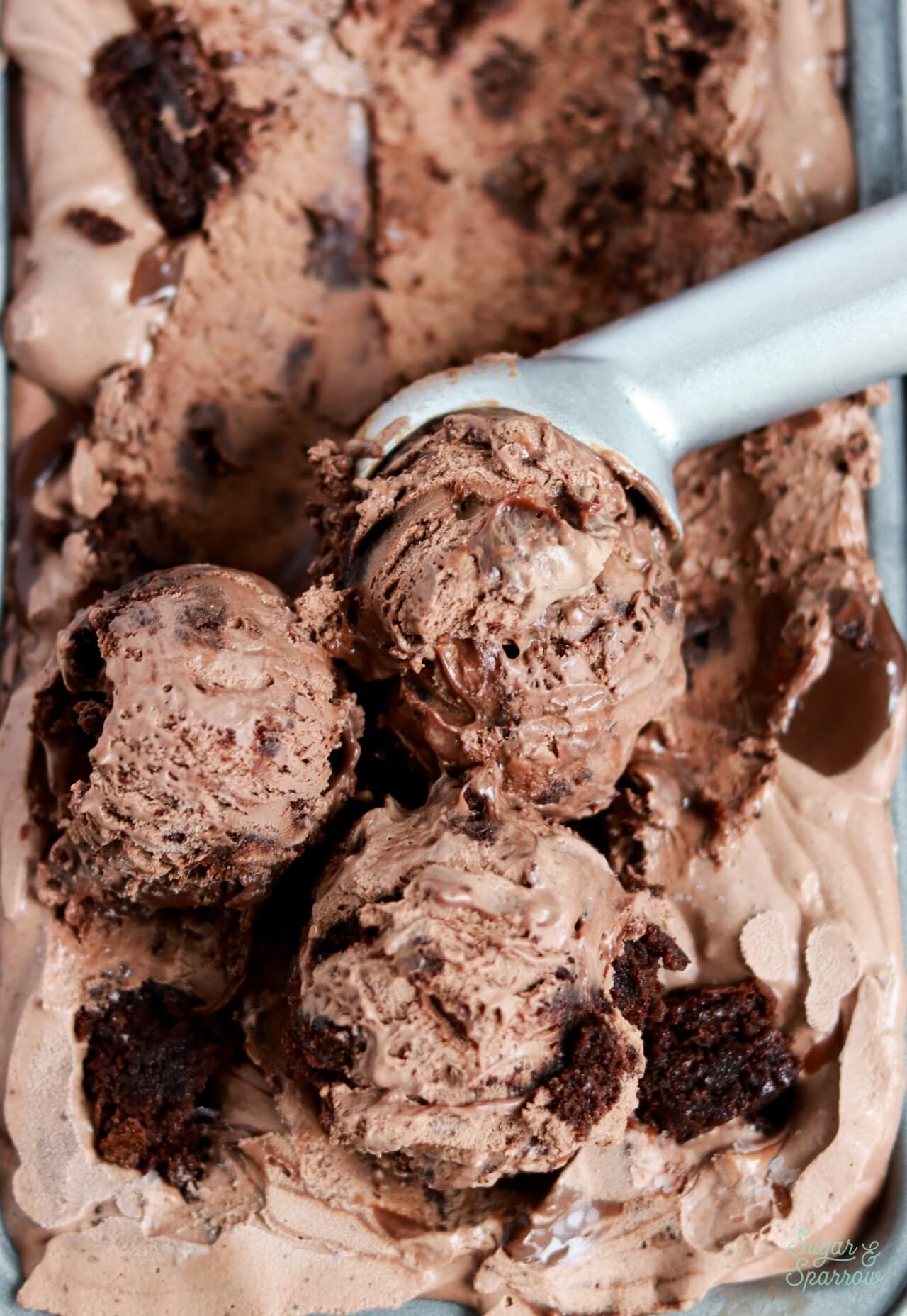 no churn chocolate brownie ice cream scoops in a loaf pan
