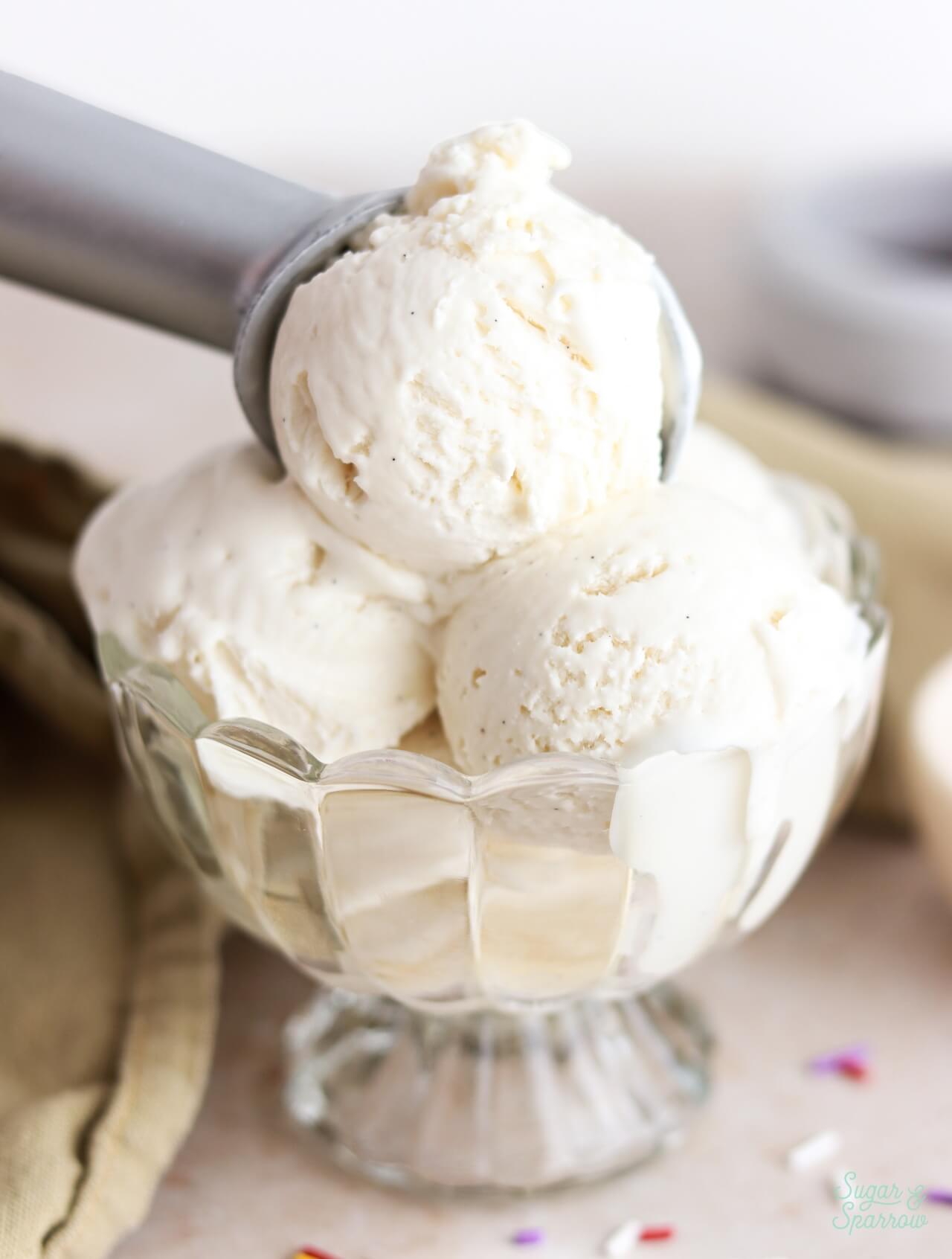 no-churn vanilla ice cream scoops in a glass dish