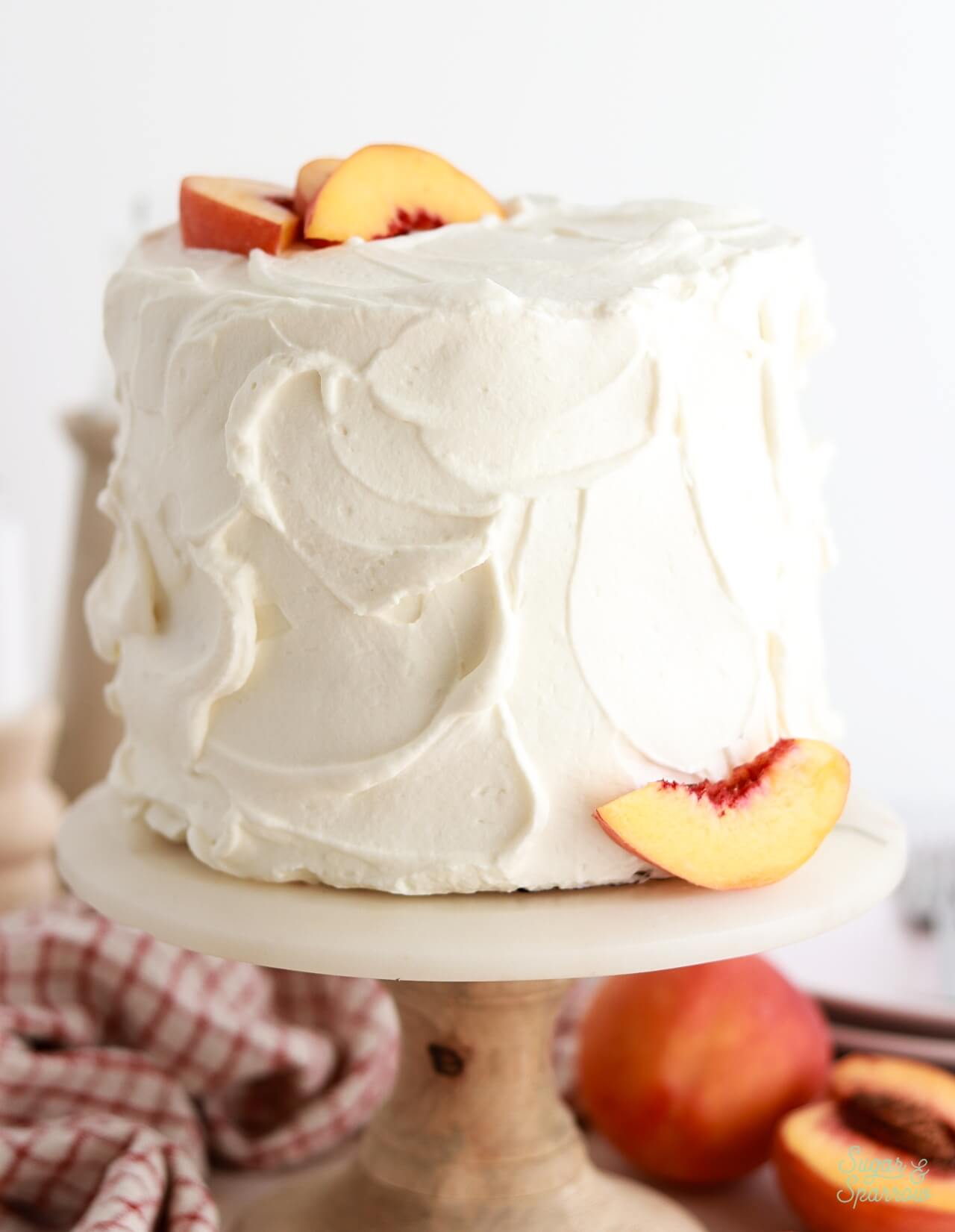 peaches and cream cake with whipped cream cheese frosting