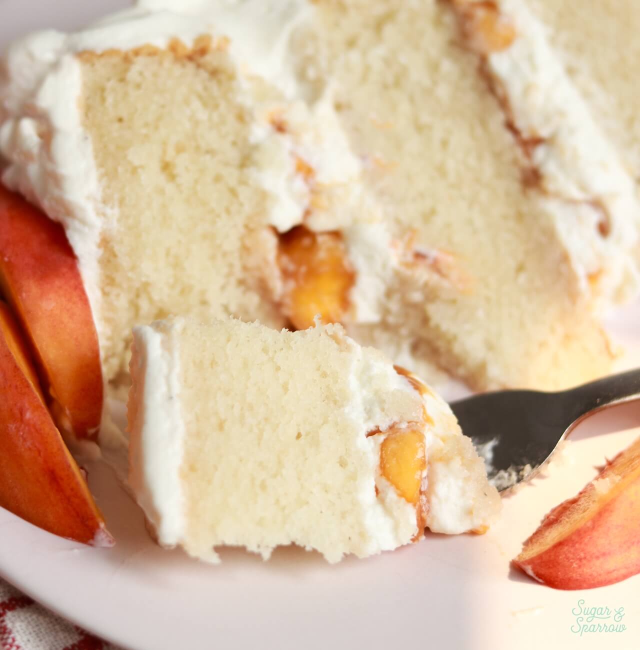 closeup of peaches and cream cake slice
