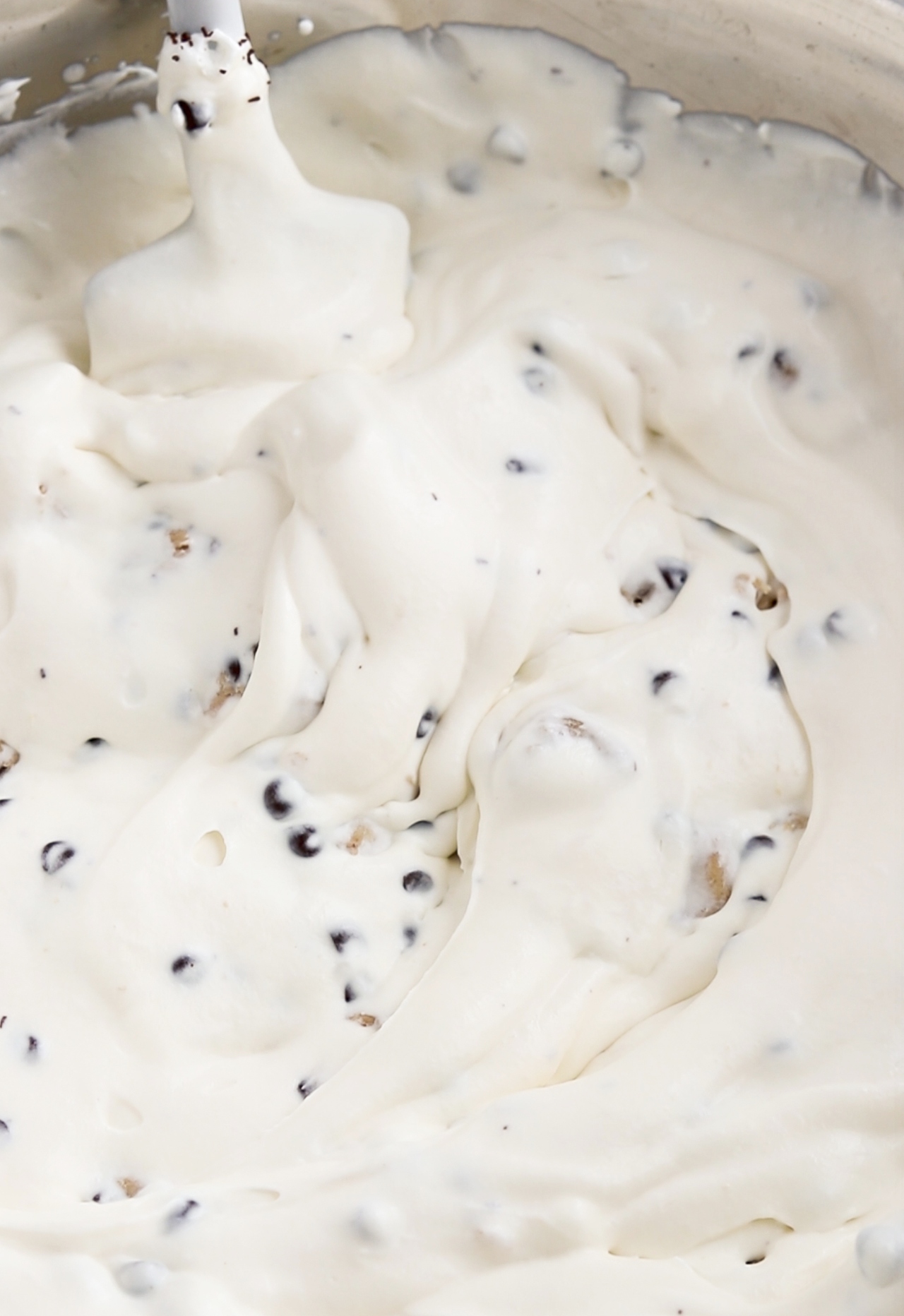 mixing cookie dough bites into ice cream