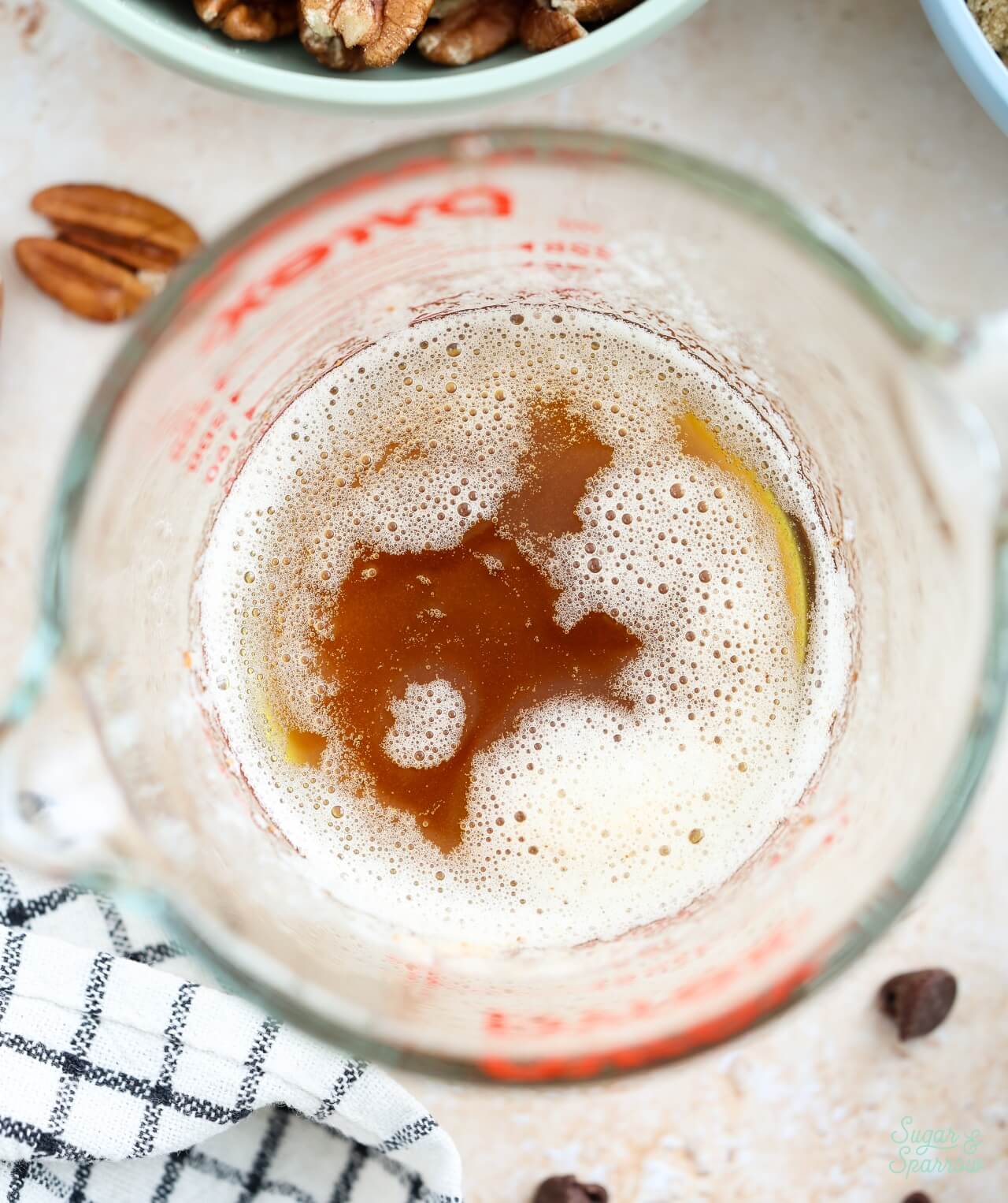 brown butter in measuring cup