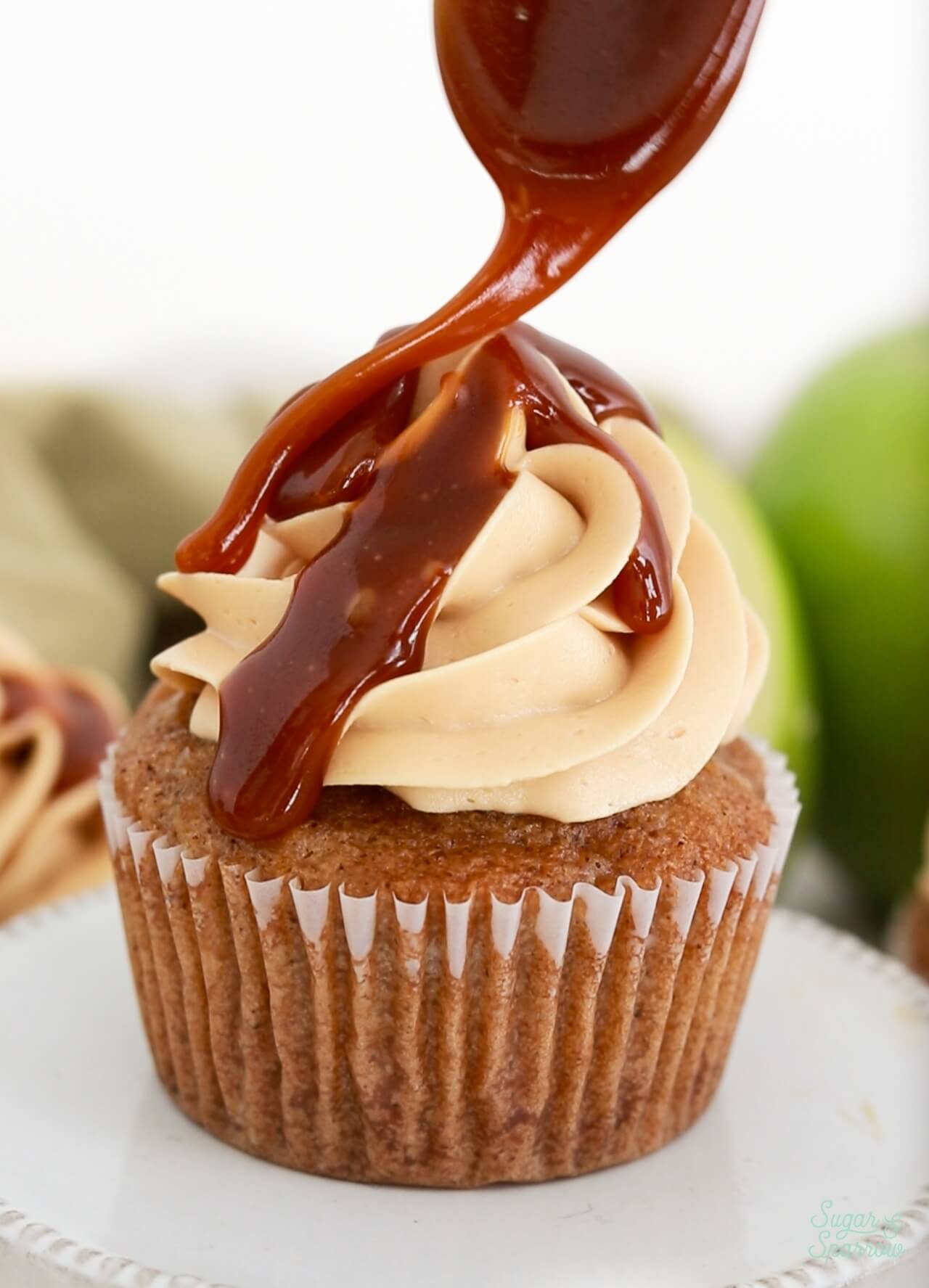 Topping cupcakes with salted caramel