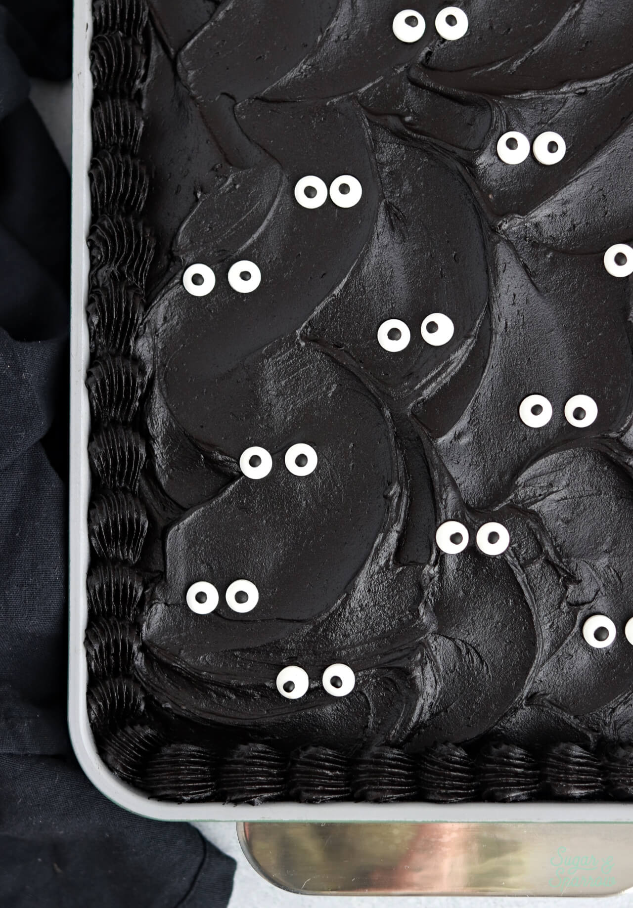 black cake with googly eye sprinkles