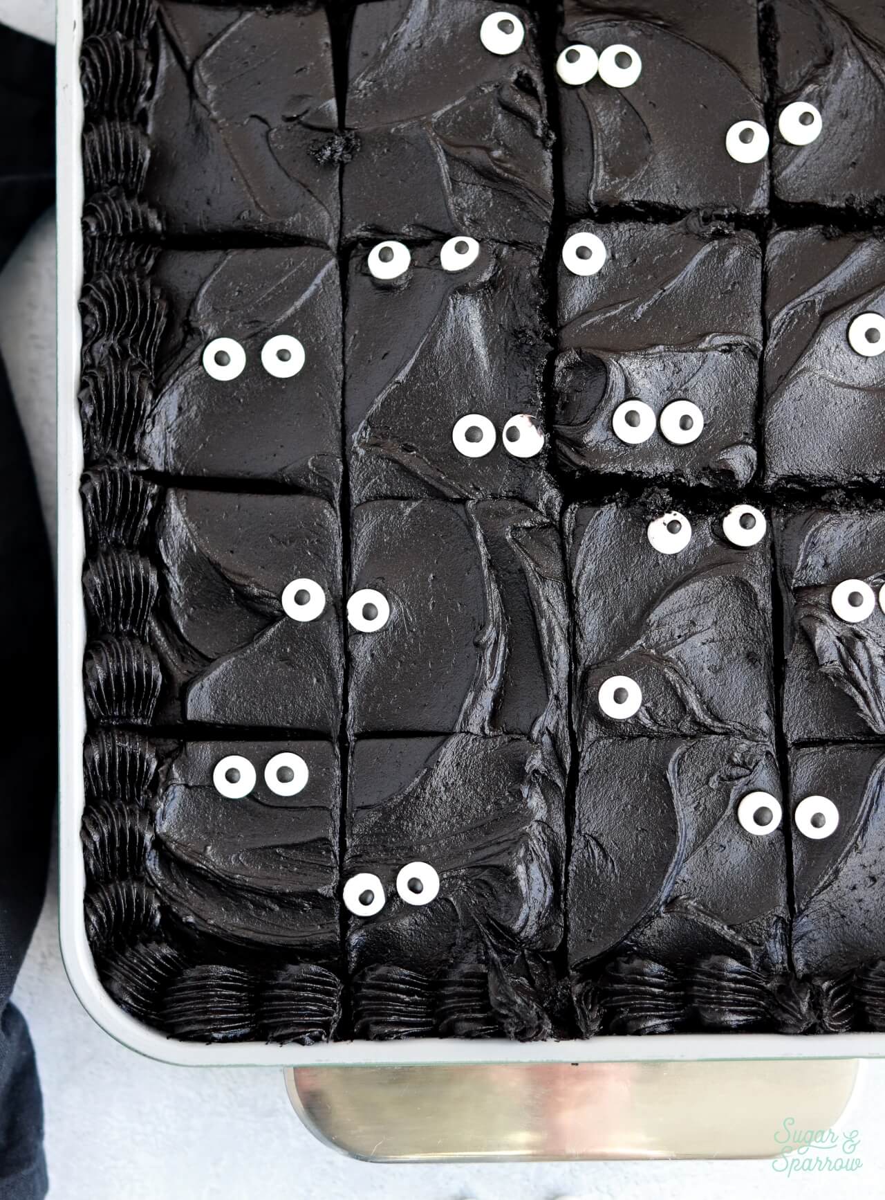 black cake with googly eyes